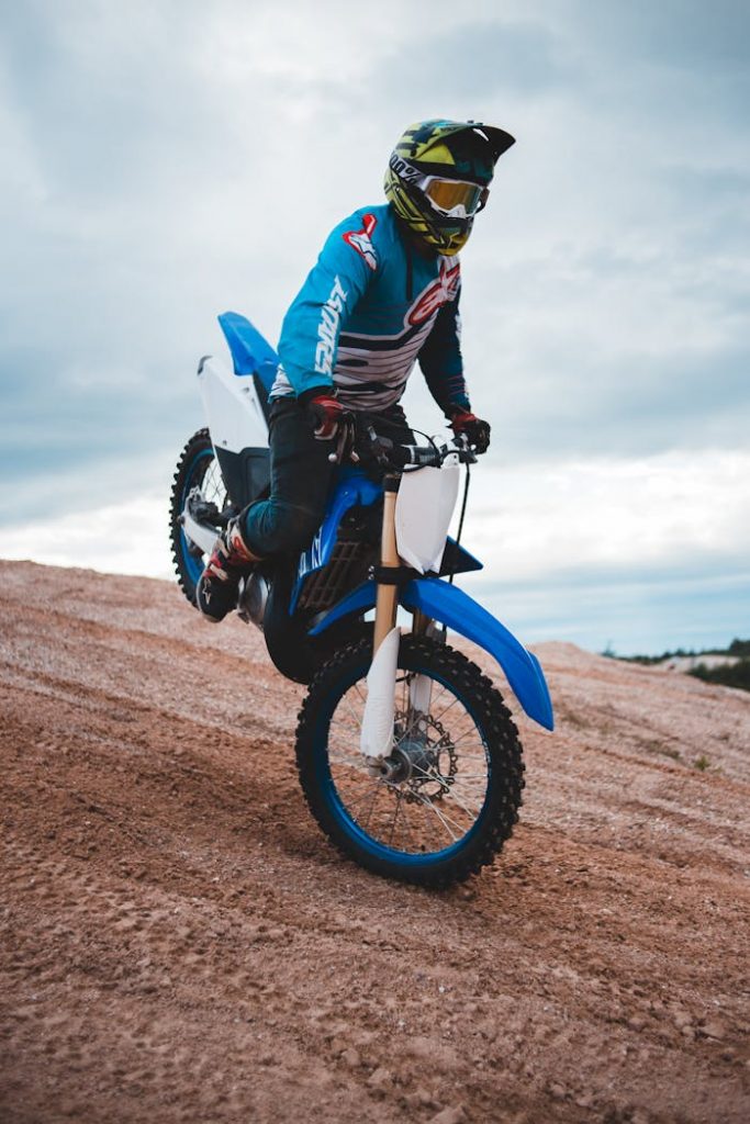 Unrecognizable biker driving down hill